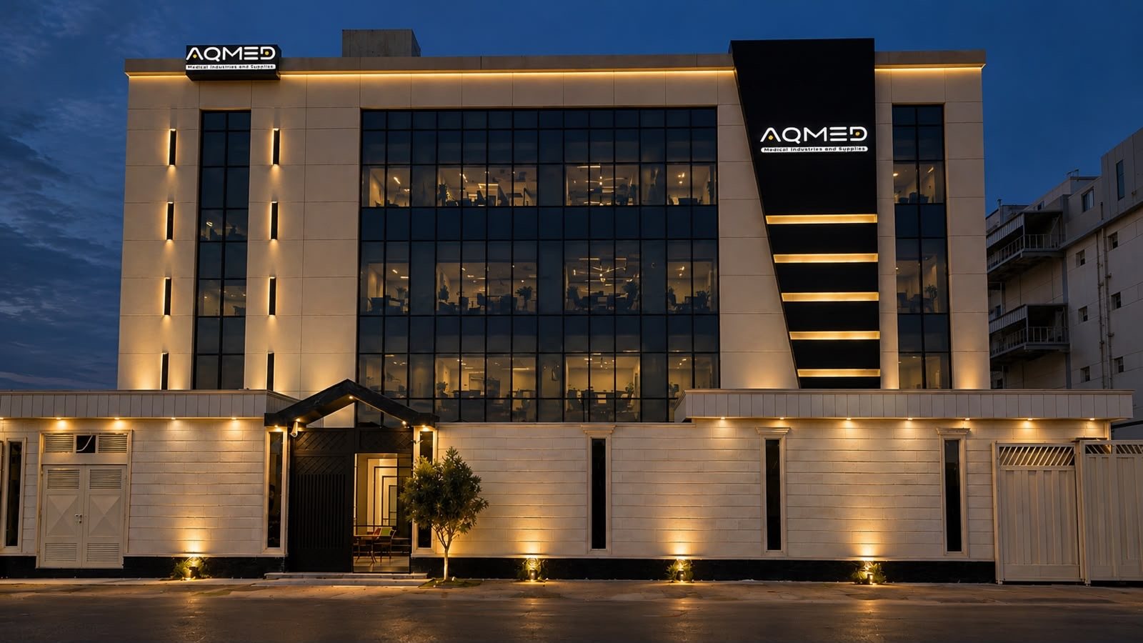 AQMED factory building at night, 10th of Ramadan City
